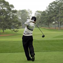 FILE - In this April 8, 2008, file photo, Toru Taniguchi of Japan tees off on the 17th hole of the Augusta National Golf Club, with the Eisenhower Tree at left, during practice for the 2008 Masters golf tournament in Augusta, Ga. The Eisenhower Tree was removed this weekend because of damage from an ice storm, the Augusta National Golf Club chairman Billy Payne said Sunday, Feb. 16, 2014. The loblolly pine was among the most famous trees in golf and it infuriated one of the club members after whom the tree eventually was named — former President Dwight D. Eisenhower. (AP Photo/David J. Phillip, File)