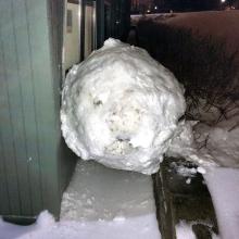 This Feb. 8, 2014 image provided by Reed College shows a large snowball that crashed into a Grove Quad dormitory at Reed College in Portland, Ore. The crash ripped a wall off its studs and narrowly missed a window. No one was injured in the collision. College officials say the ball was some 40 inches in diameter and weighed from 800 to 900 pounds.(AP Photo/Reed Magazine)