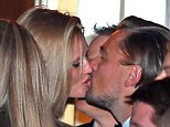 Someone's in the mood for celebrating! Leonardo DiCaprio was seen kissing girlfriend Toni Garrn at the CAA Golden Globes after party on Sunday night