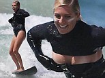 Wipe-out! Stephanie Gilmore laughs as she loses control of her outfit while surfing at Bondi Beach