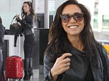 And she's off again! Myleene Klass does runway chic in black leather as she jets out of Heathrow