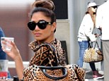Planning a musical comeback? Nicole Scherzinger in double leopard-printed as she lunches with top music producer Tricky Stewart in Miami
