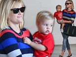 Back in mommy mode! Reese Witherspoon sports sweater and jeans for excursion with mini-me son Tennessee... days after glamming up at Golden Globes