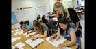Amy Lawson, a fifth-grade teacher at Silver Lake Elementary School in Middletown, Del., helps student Melody Fritz with an English language arts lesson Oct. 1, 2013. Silver Lake has begun implementing the national Common Core State Standards for academics. Remembering the plot of a short story is no longer good enough in Lawson’s fifth-grade classroom. Now, students are being asked to think more critically -- what, for example, might a character say in an email to a friend. "It’s hard. But you can handle this," Lawson tells them. Welcome to a classroom using the Common Core State Standards, one of the most politicized and misunderstood changes in education for students and their teachers in grades kindergarten through high school. (AP Photo/Steve Ruark)