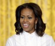 In this Friday, Nov. 8, 2013 file photo, first lady Michelle Obama speaks in the East Room of the White House in Washington, at a workshop for high school students from Washington, New York and Boston about careers in film. The first lady led an outpouring of support for Robin Roberts on Monday, Dec. 30, 2013, following the ABC News anchor’s first public acknowledgement of her 10-year, same-sex relationship with massage therapist Amber Laign. (AP Photo/Susan Walsh, File)